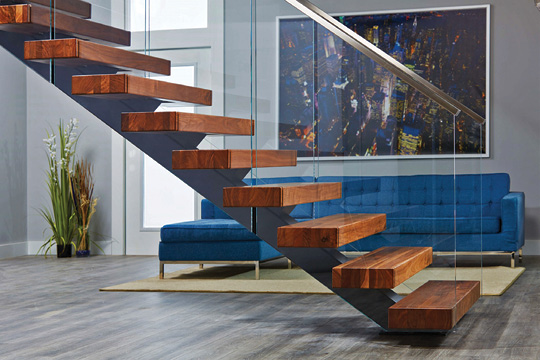 living room stairway with glass railing