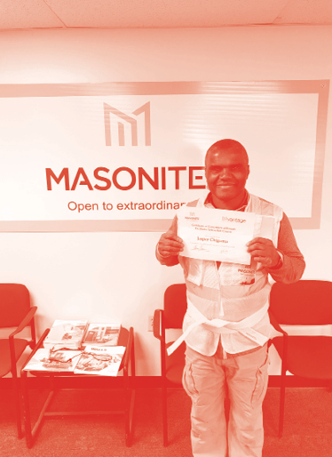 Masonite associate receives Certificate of Completion of Kaizen Facilitator Yellow Belt Course.